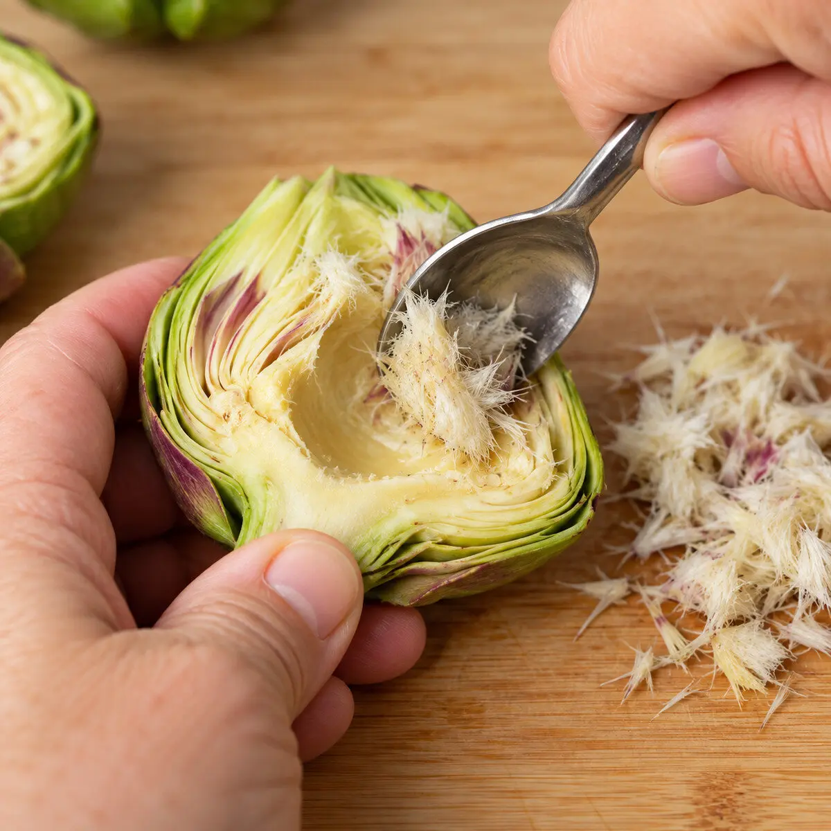 Preparation step for Roasted Korean Parmesan Artichokes.