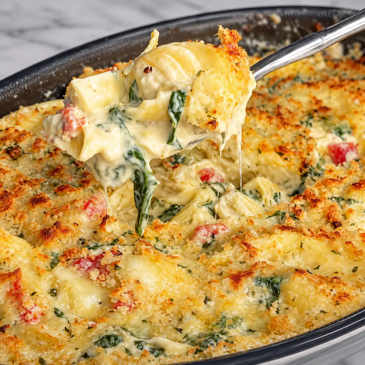 Preparation step for Spinach/Artichoke Dip Tortellini.