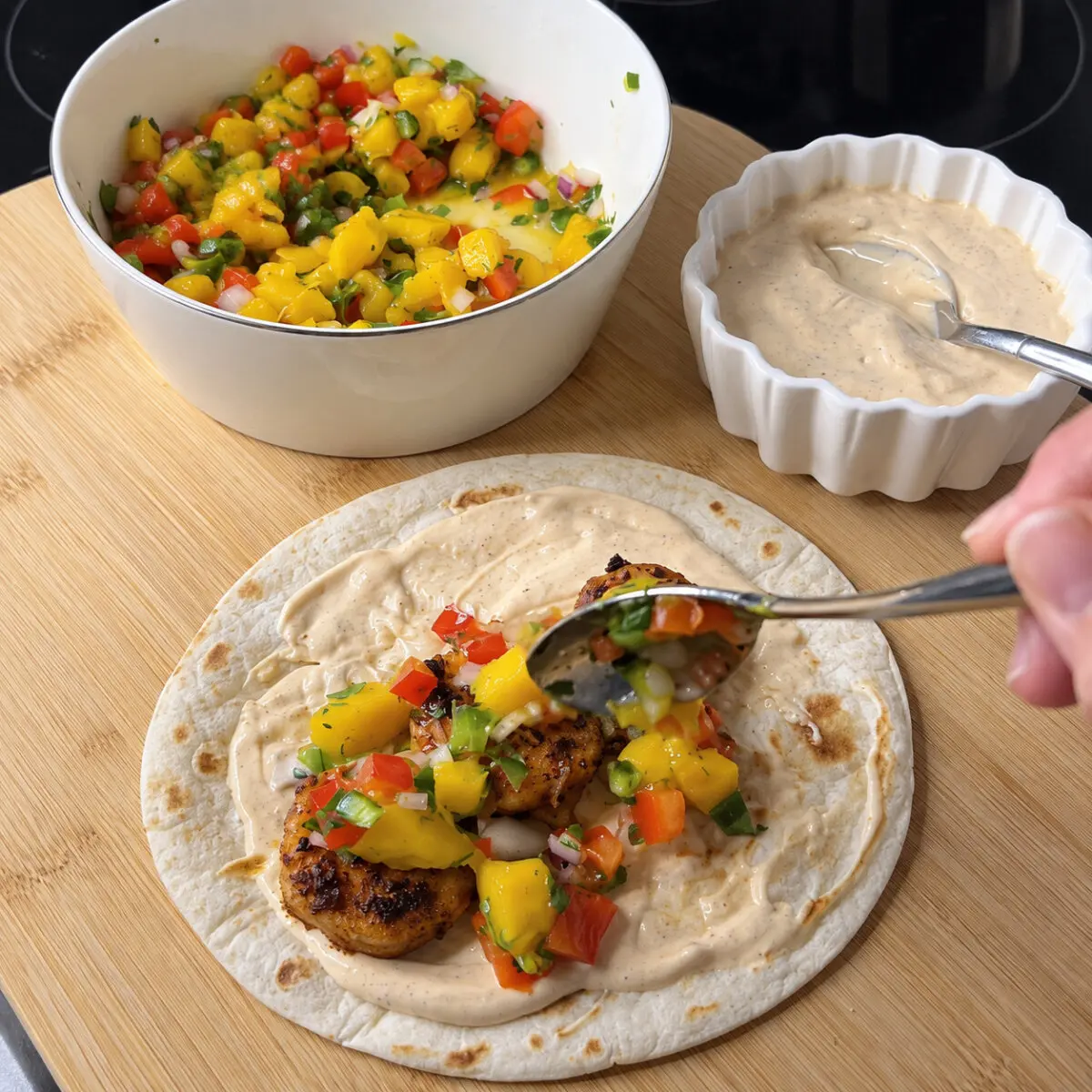 Preparation step for Jamaican Jerk Tacos with Spicy Jerk Aioli and Mango Salsa.