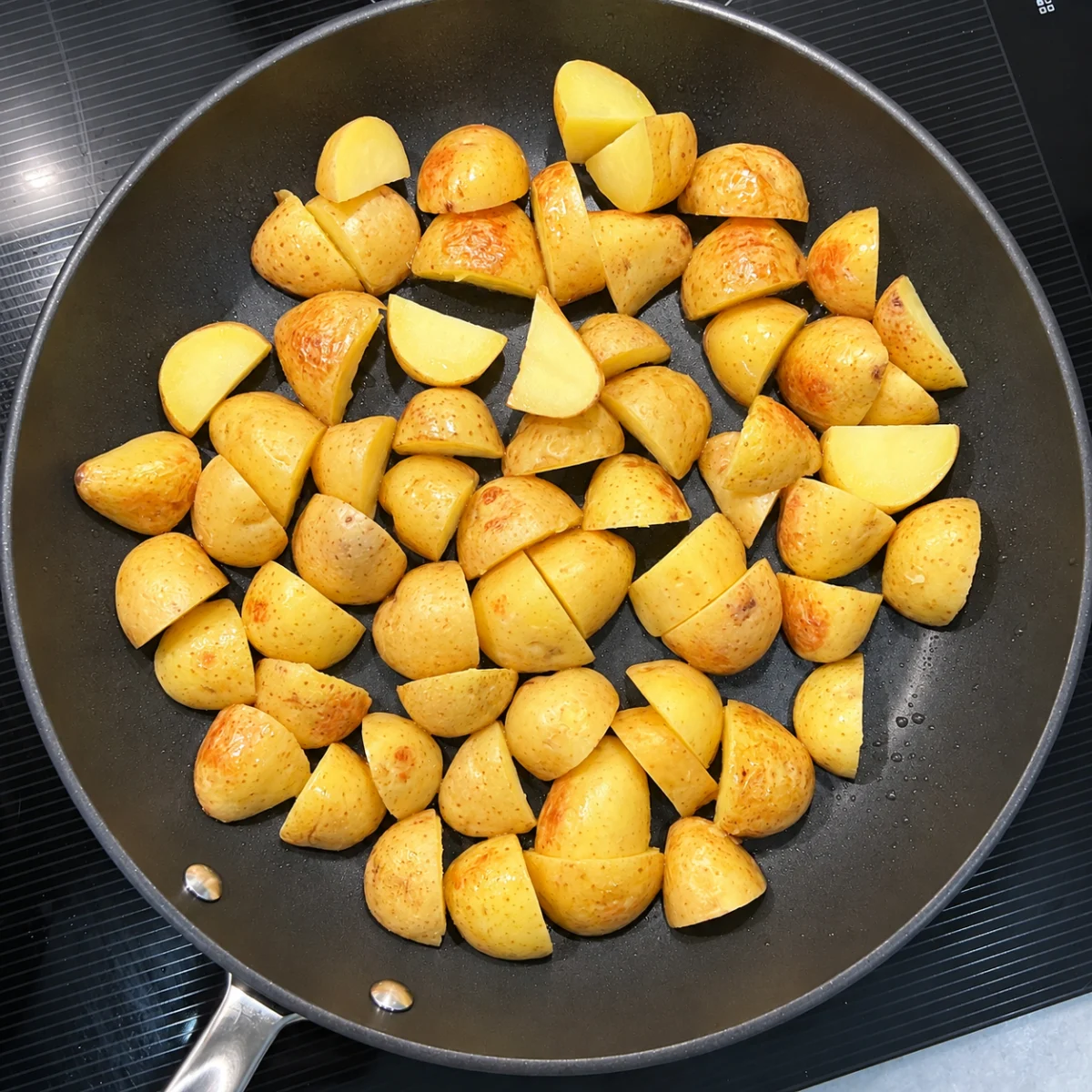 Preparation step for Patatas Bravas Breakfast Hash.